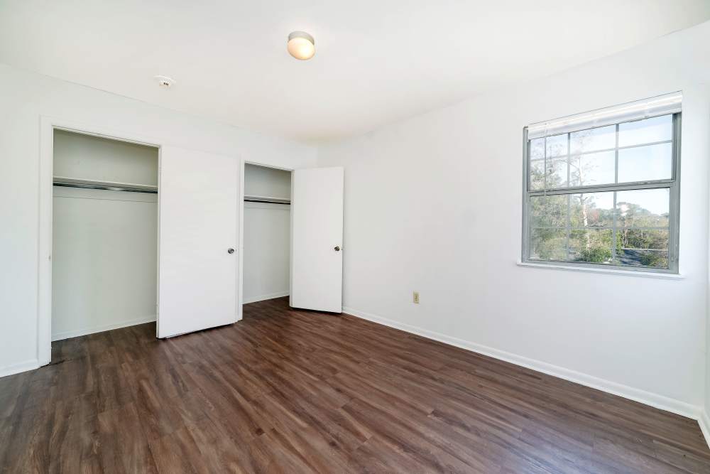Bedroom with closet and window at Magnolia Terrace in Tallahassee, Florida