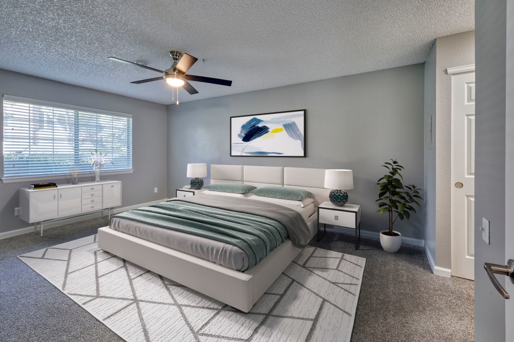 Stylish large oversized bedroom at Arapahoe Club Apartments in Denver, Colorado