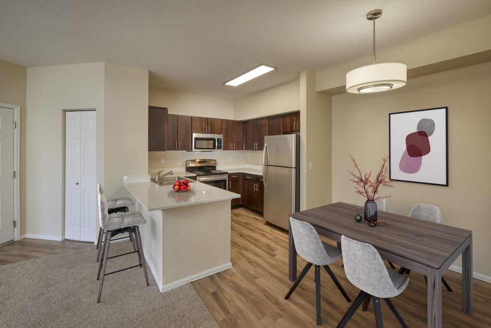 A kitchen with plenty of cabinet space at The Crossings at Bear Creek Apartments in Lakewood, Colorado