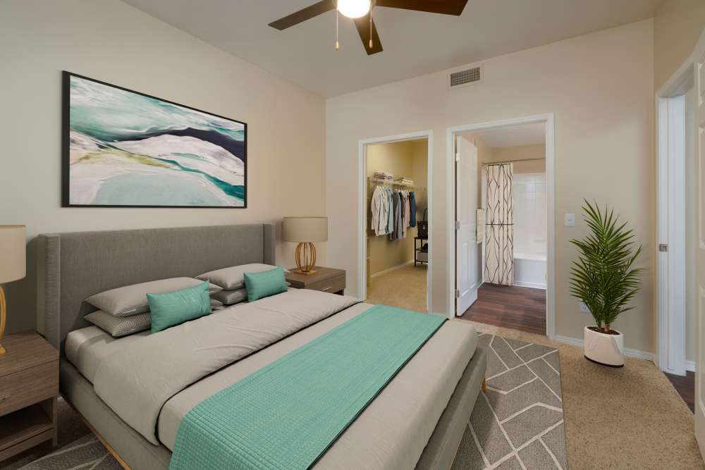 Modern bedroom with high ceilings and closet at Promenade at Hunter's Glen Apartments in Thornton, Colorado