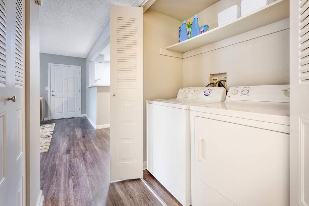 Kitchen with wood-style flooring at Alton Green Apartments in Denver, Colorado