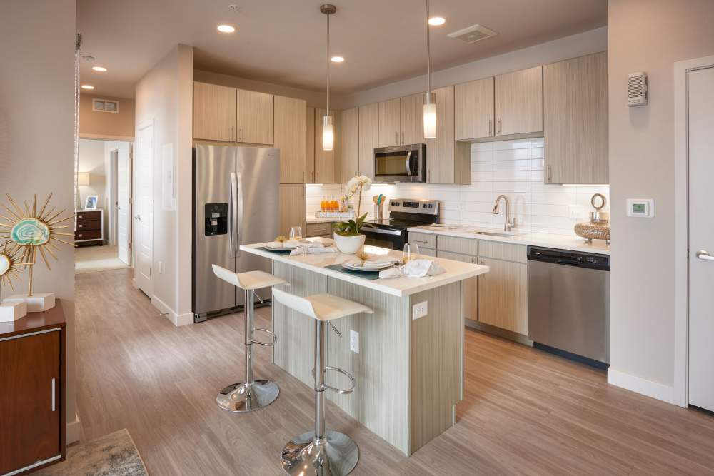 Kitchen with modern appliances and furnishings at Strata Apartments in Denver, Colorado