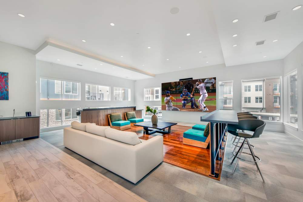 Resident lounge with large TV at Elevate in Englewood, Colorado