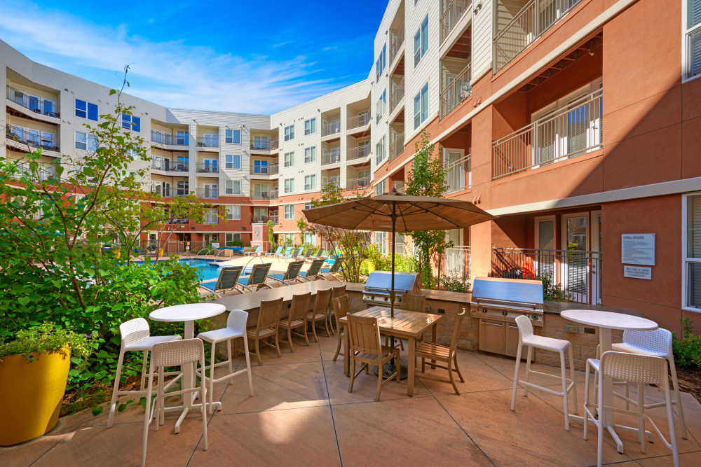 Outdoor seating with grilling station at Helios in Englewood, Colorado