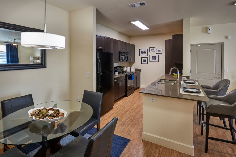 Dining area with kitchen view at M2 Apartments in Denver, Colorado
