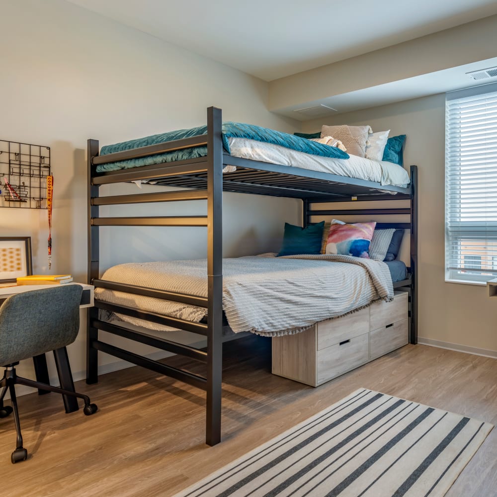 Spacious bedroom with a study nook at UNCOMMON Dinkytown in Minneapolis, Minnesota