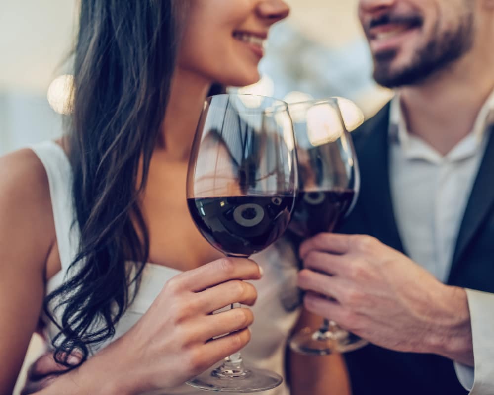 Two residents having a glass of wine at The District at Scottsdale in Scottsdale, Arizona
