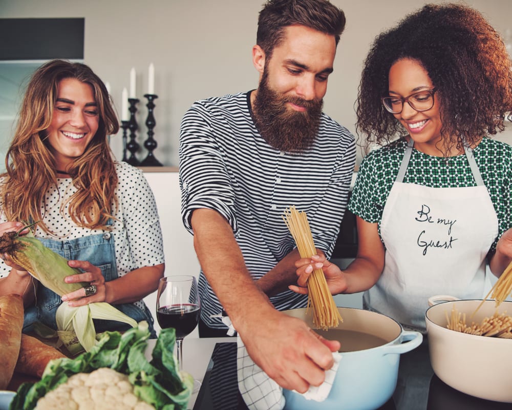 Residents cooking up an organic, fresh meal in their new home at Sofi Belmont Glen in Belmont, California