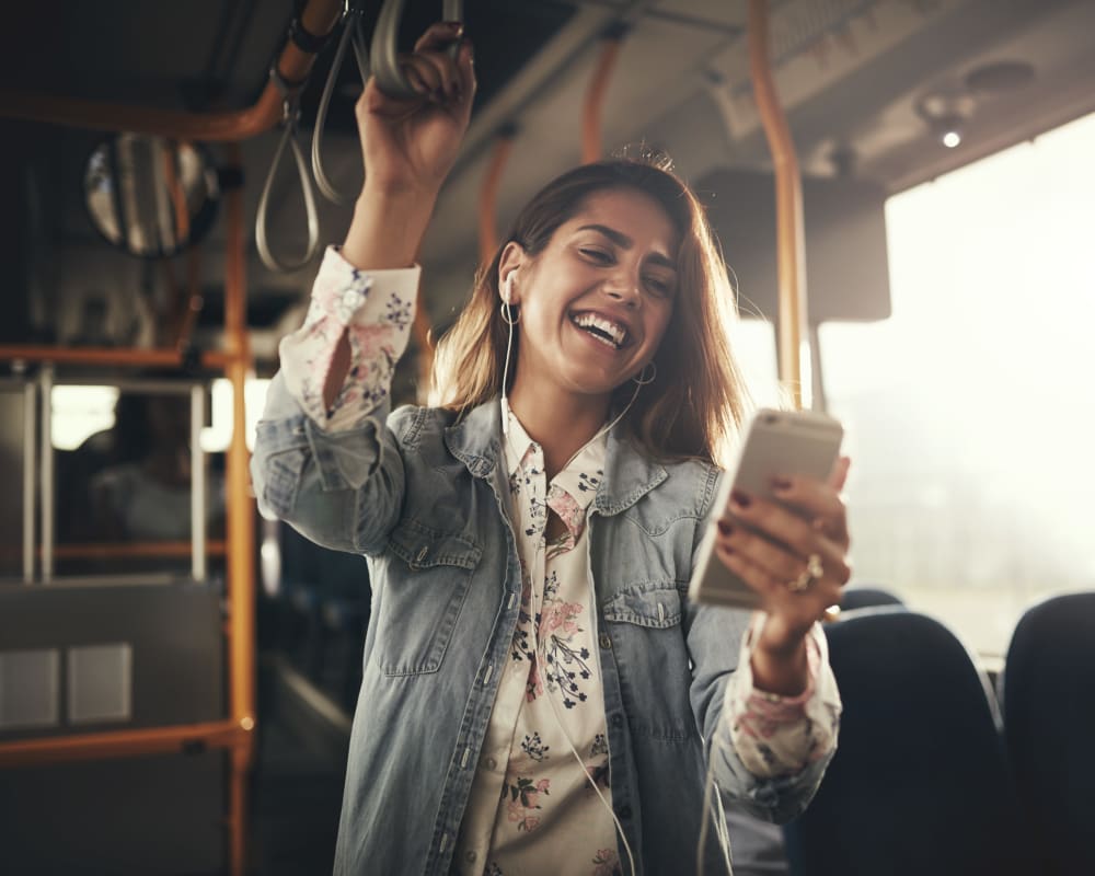 Resident student riding the bus to school from a transit stop very close to Sofi Warner Center in Woodland Hills, California