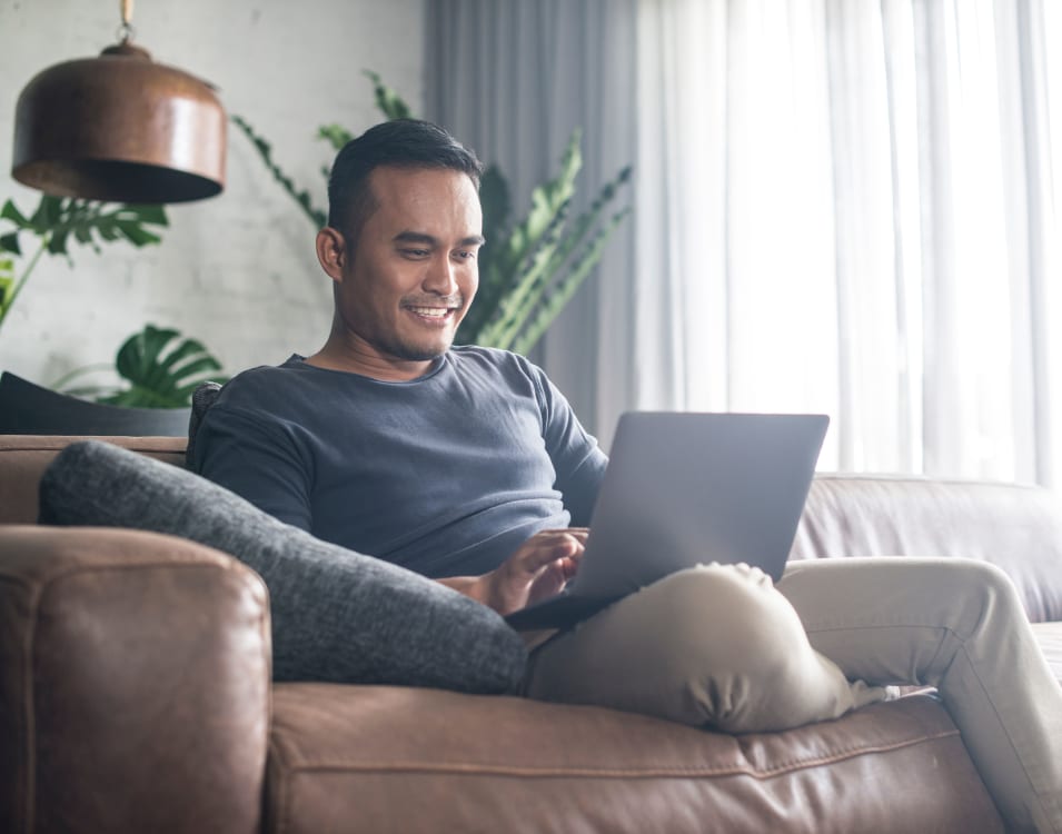 Resident student working on his computer from home at Villa Del Sol in Sunnyvale, California