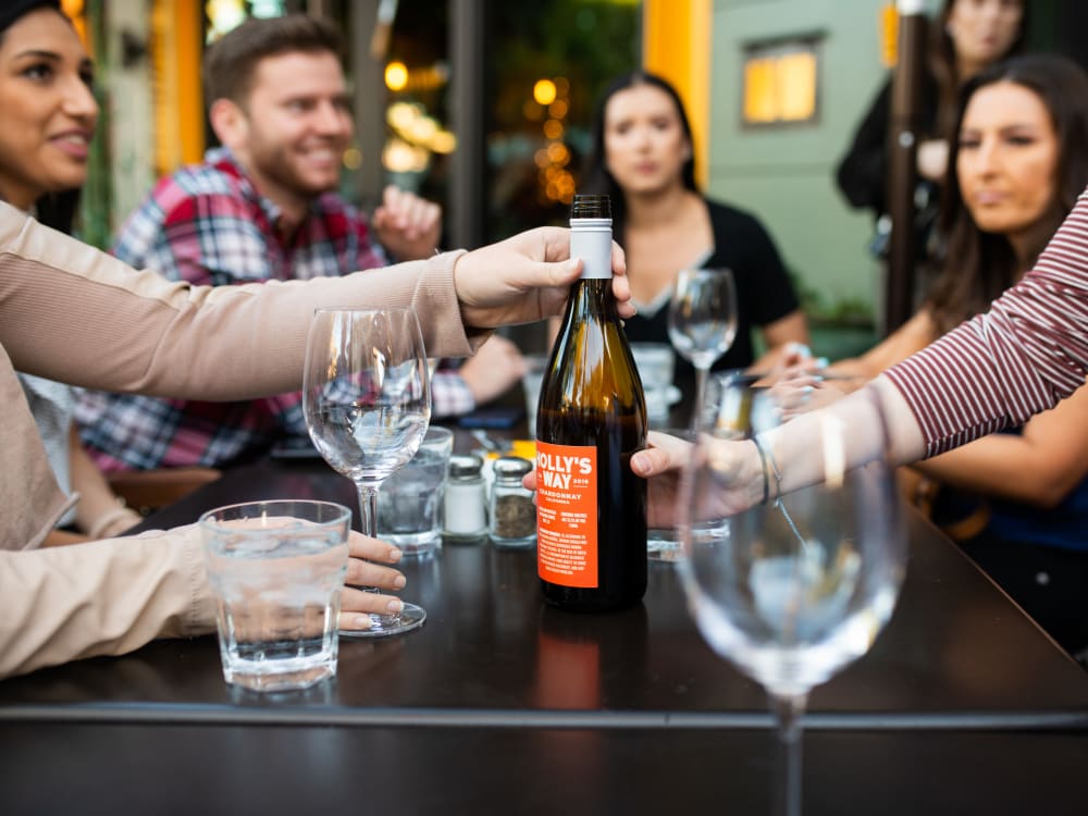 Resident enjoying wine near San Cervantes in Chandler, Arizona