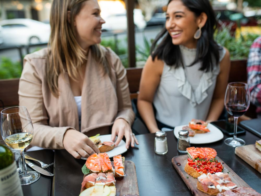 Resident friends out for a bite to eat near Avant at Fashion Center in Chandler, Arizona