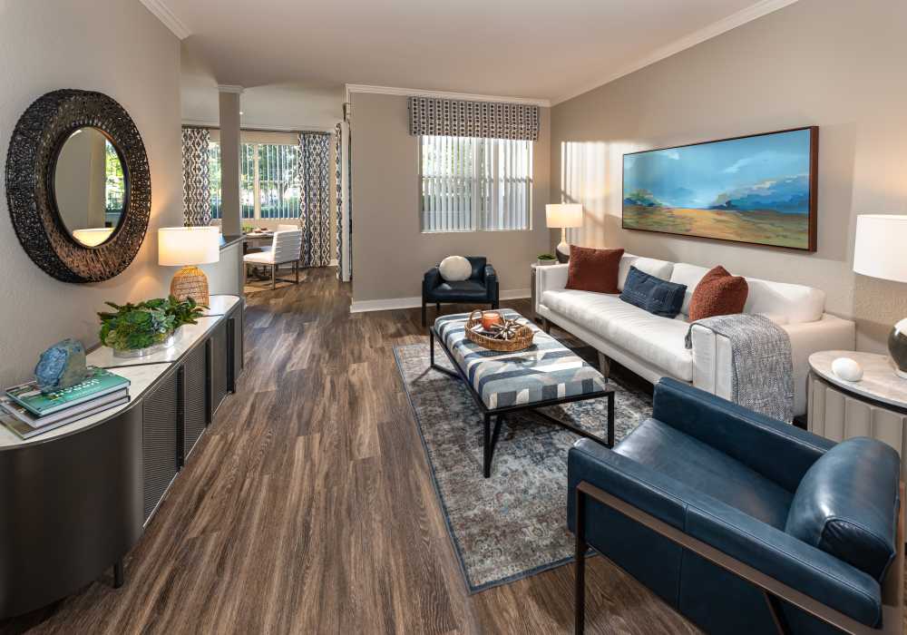 Spacious living room with large sofa and coffee-table at Park Hacienda Apartments in Pleasanton, California,