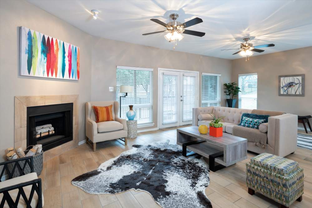 Clubhouse with Seating, fireplace and French glass doors at The Quorum At Trophy Club in Trophy Club, Texas