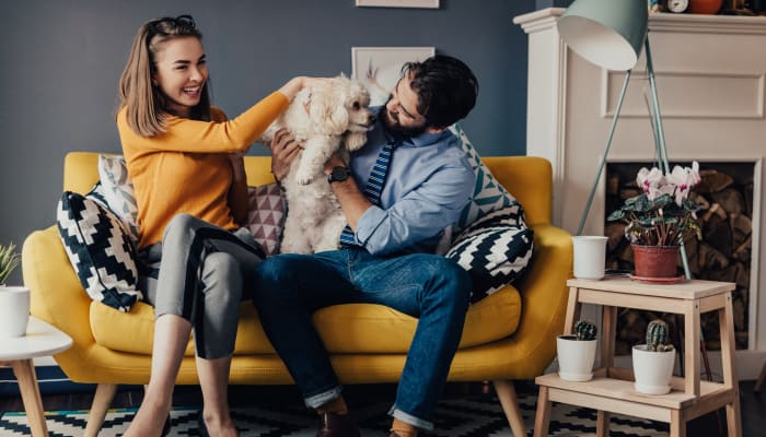 Couple enjoying time with their dog at Veranda in Texas City, Texas