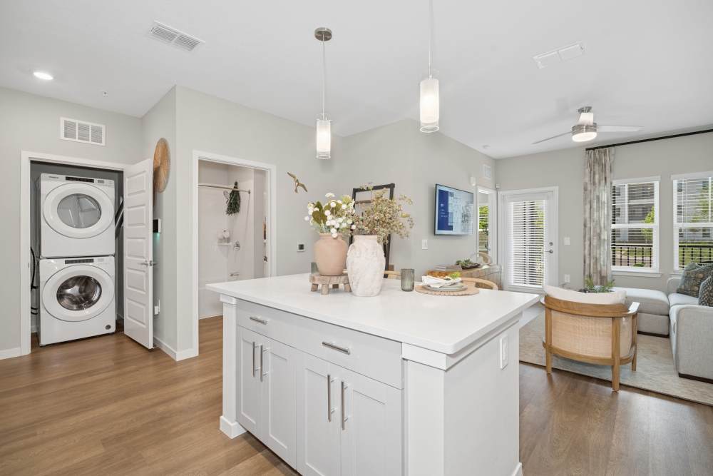 Living space with wood-style flooring at Savelle Nona West in Orlando, Florida