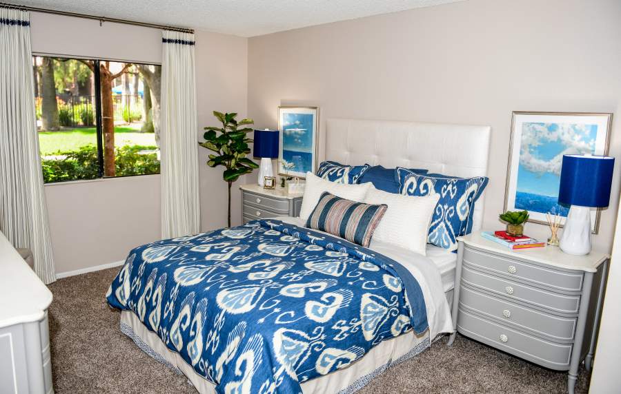 Modern bedroom at Parcwood Apartments in Corona, California