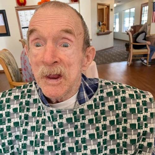 Excited resident wearing a christmas sweater at Ashbrook Village in Duncan, Oklahoma