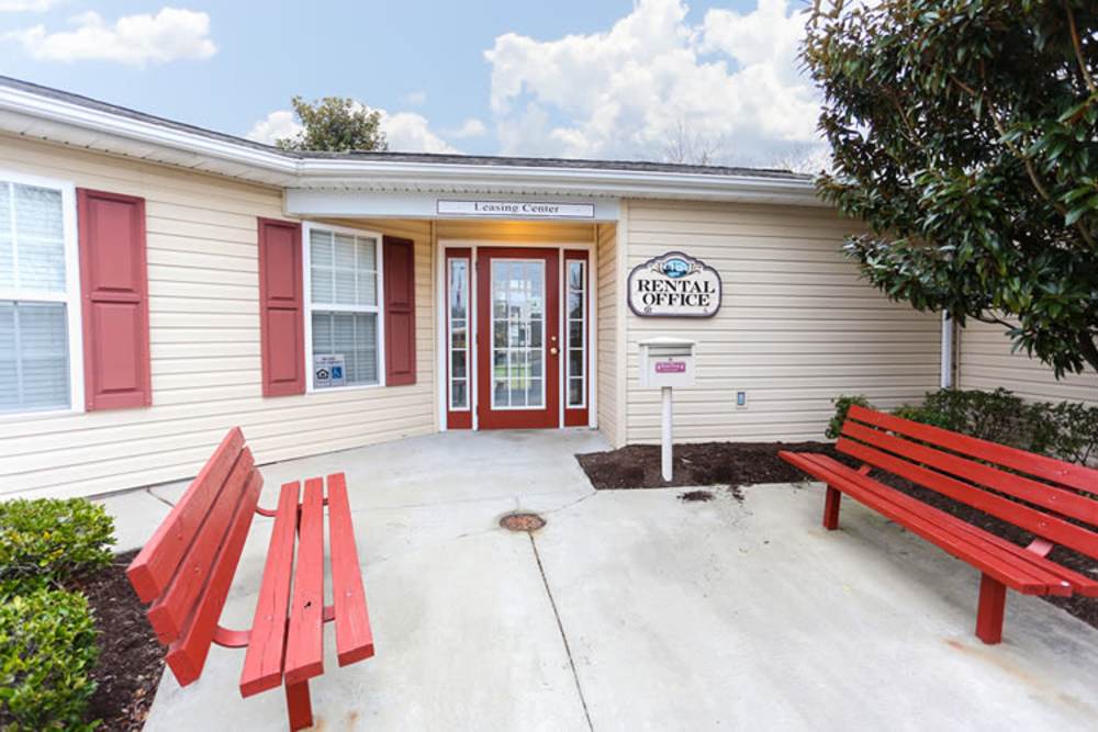 Rental office of the apartments with seating benches at Landmark Apartments in Chesapeake, Virginia