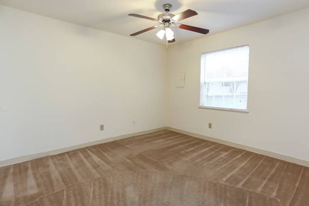 Bedroom with ceiling fan at Landmark Apartments in Chesapeake, Virginia