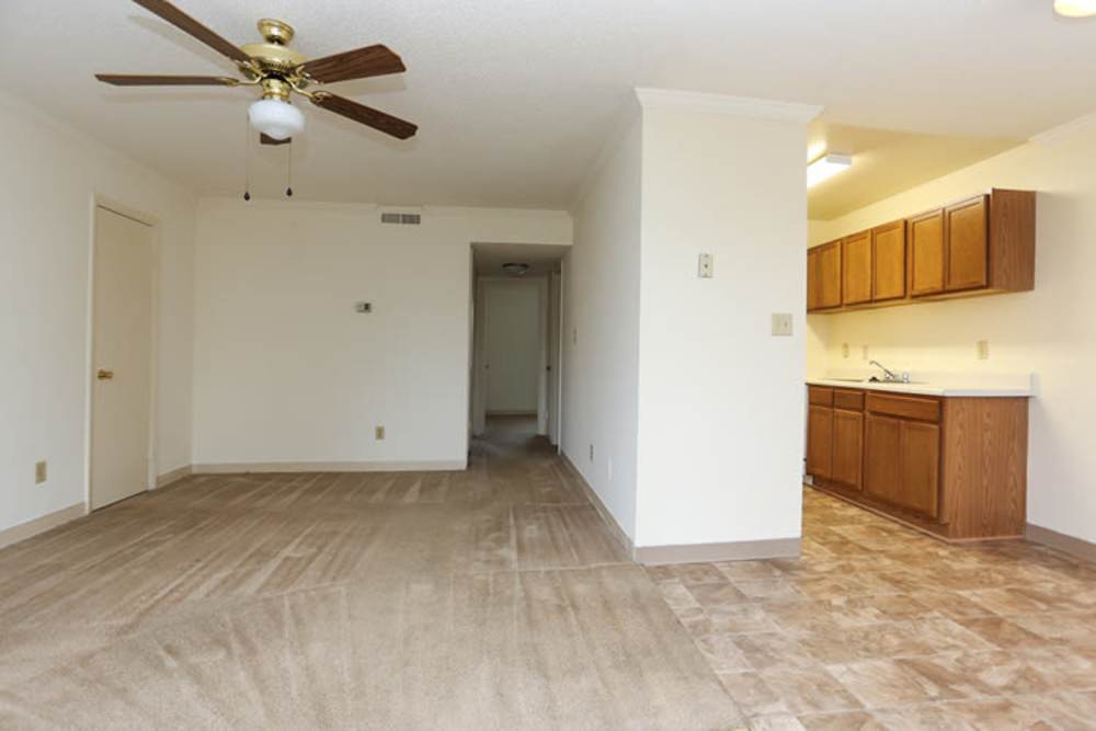 Apartment kitchen connected to the living area at Landmark Apartments in Chesapeake, Virginia