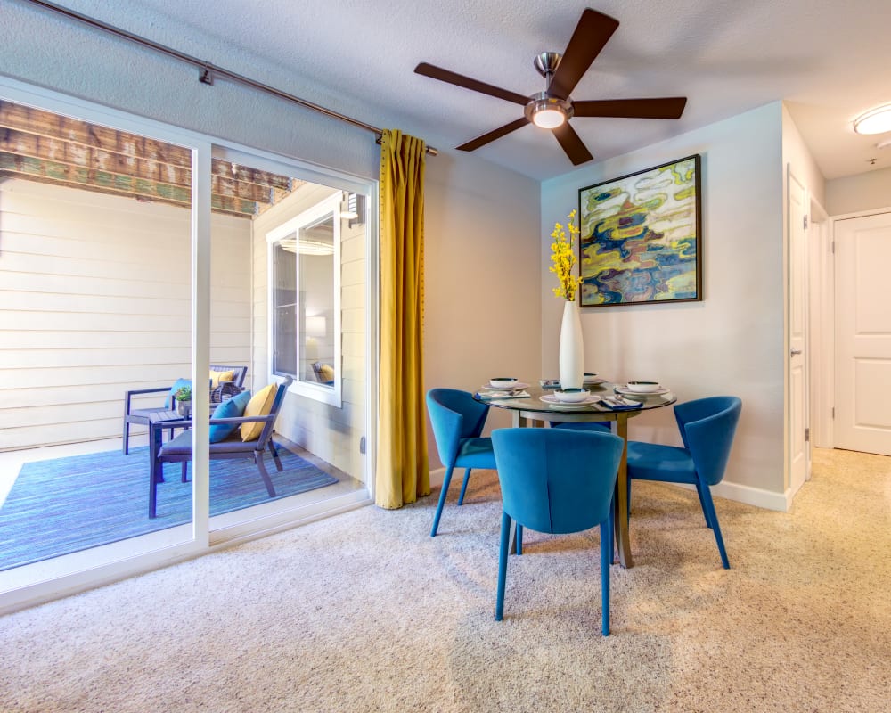 Dining area with sliding doors to the private patio outside a model home at Sofi Sunnyvale in Sunnyvale, California