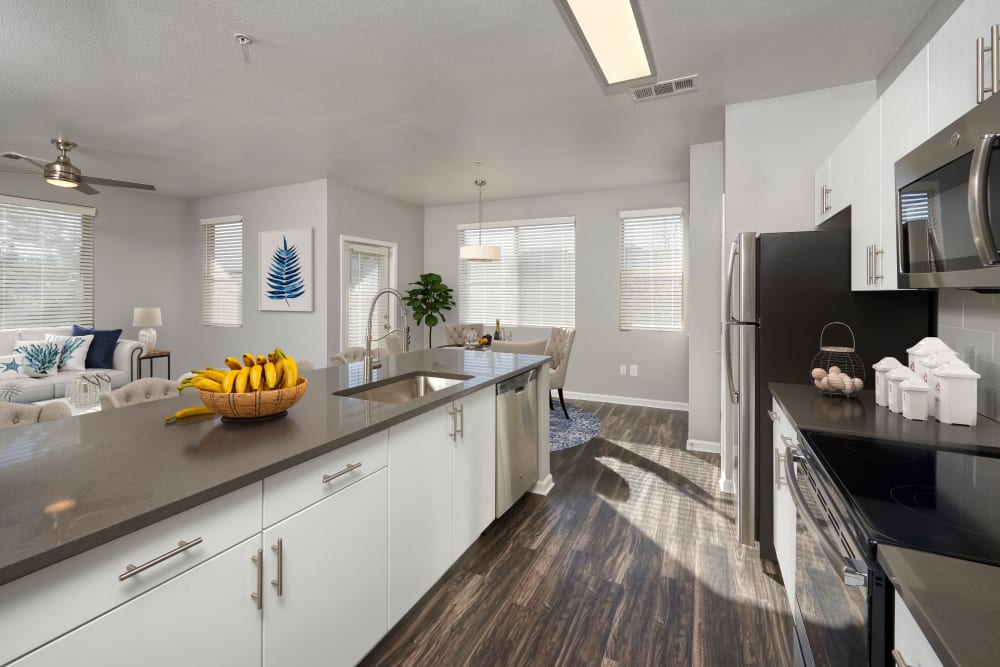 Kitchen with wood-style flooring at The Rail at Inverness in Englewood, Colorado