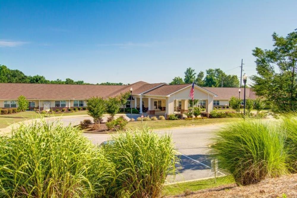 Green landscaping and exterior at Carolina Gardens at Conway in Conway, South Carolina