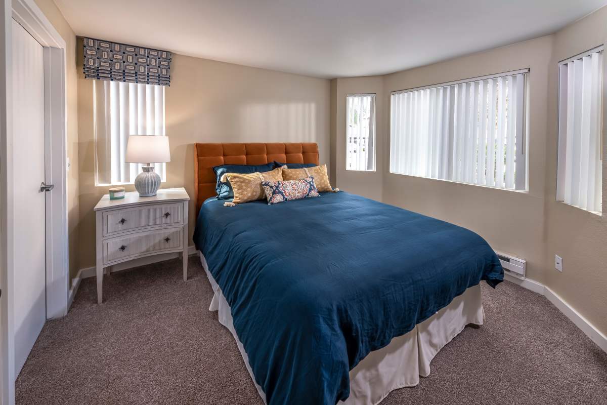 Model apartment bedroom at Redmond Place Apartments in Redmond, Washington