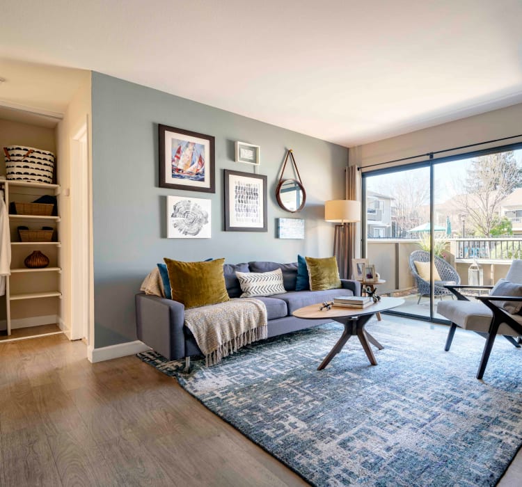 Hardwood flooring and an accent wall in a model home's living space at Sofi Berryessa in San Jose, California
