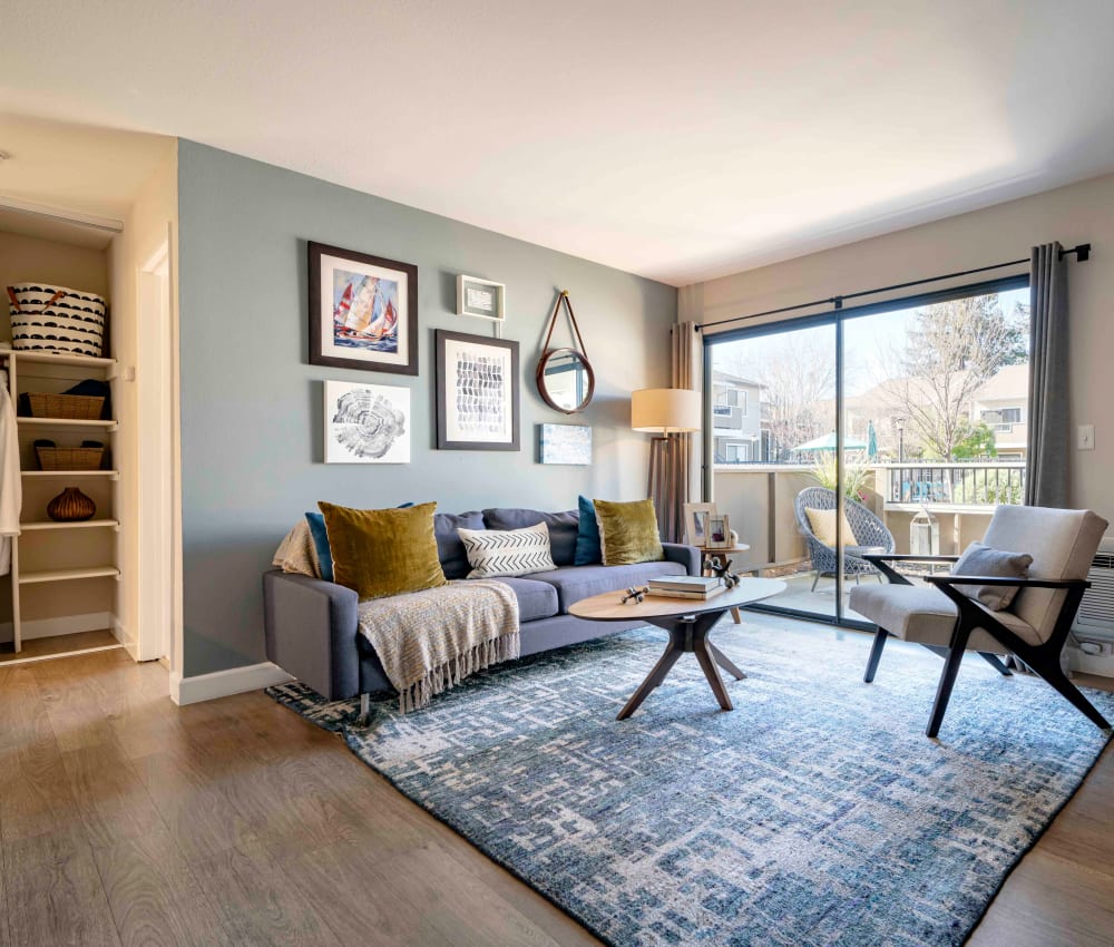 Hardwood flooring and an accent wall in a model home's living space at Sofi Berryessa in San Jose, California