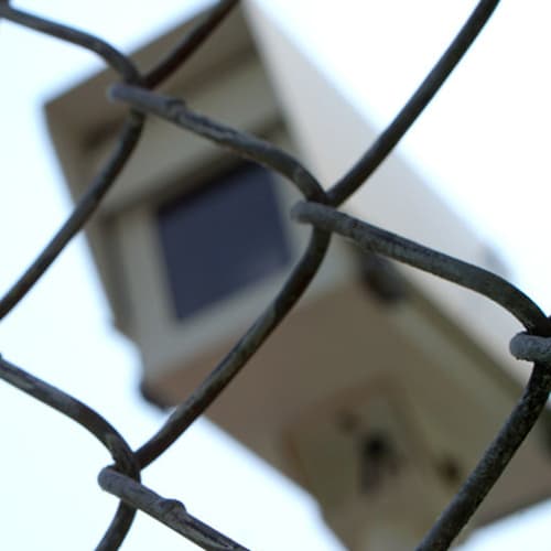 Security camera behind a fence at Red Dot Storage in Huntsville, Alabama