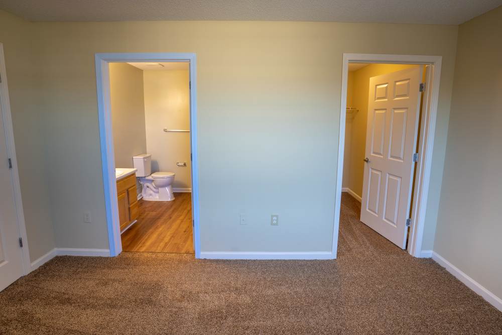 Master bedroom with access to bathroom and closet at Eagles Landing in Memphis, Tennessee