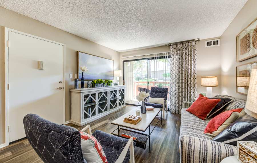 Modern and spacious living room at Parcwood Apartments in Corona, California