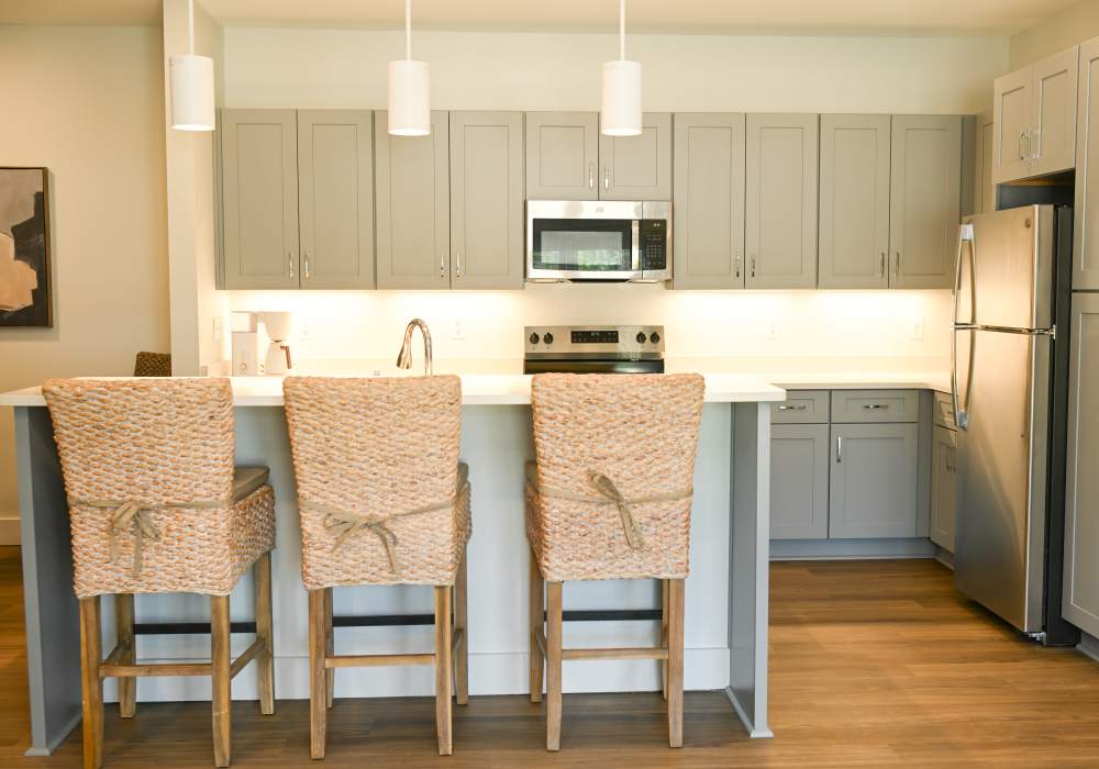 Kitchen with grey color cabinet at Anchor Apartments in Freeport, Florida