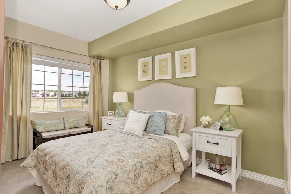 White serene bedroom at Chancellor Gardens in Clearfield, Utah
