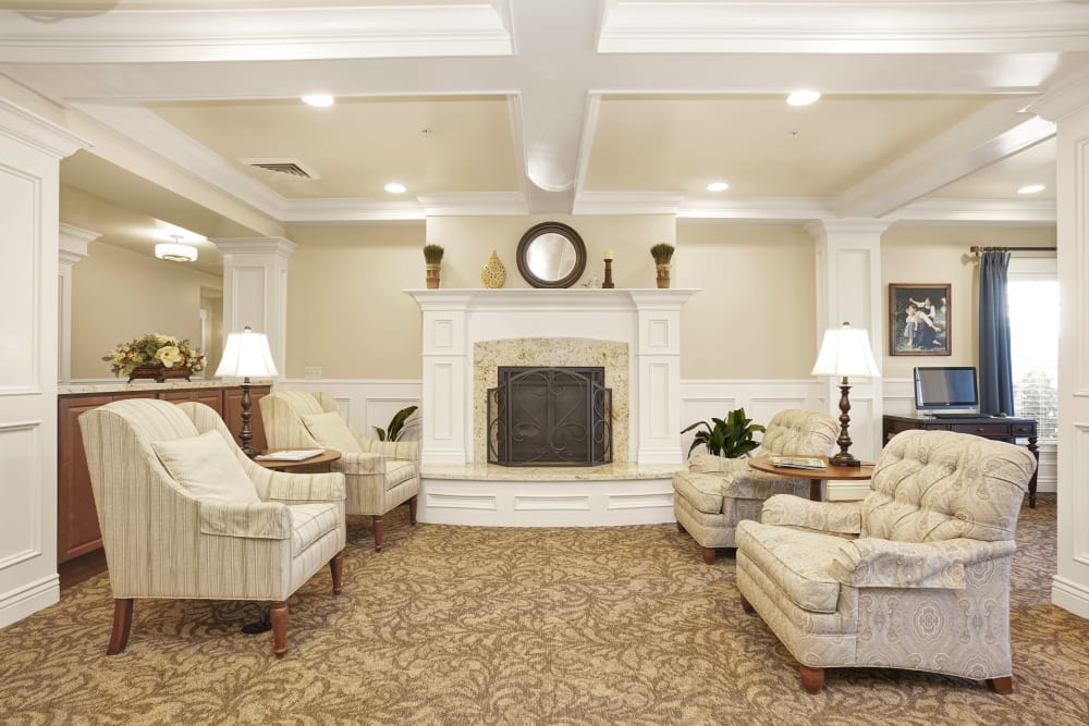 Elegant lounge area with fireplace at Highland Glen in Highland, Utah