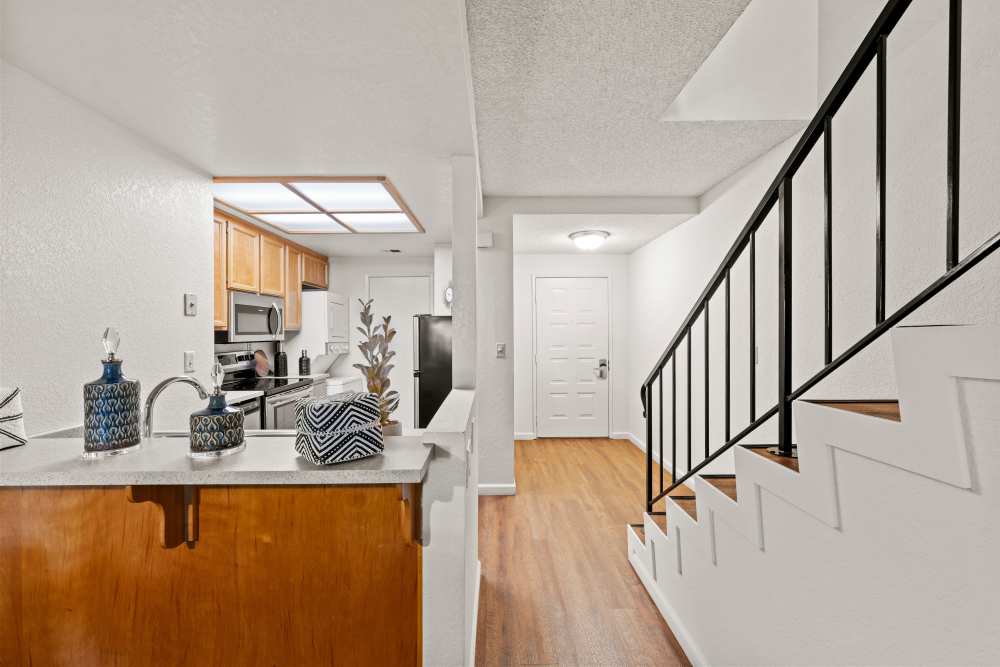 Staircase with kitchen area at Ardenwood Forest Rental Condominiums in Fremont, California