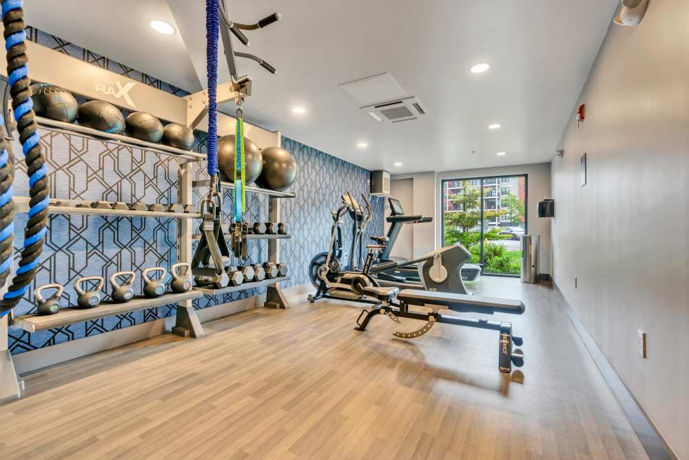 Exercise equipment and weights in gym at Latitude at South Portland in Portland, Maine
