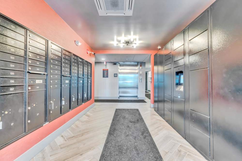 Mailboxes line the wall with an elevator at Latitude at South Portland in Portland, Maine