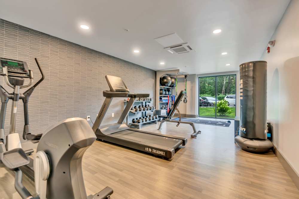 Treadmill and weights in fitness room at Latitude at South Portland in Portland, Maine