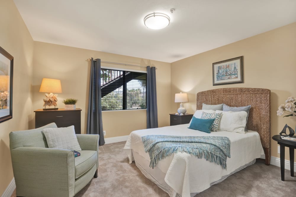 Cozy bedroom with large bed and excellent lighting at The Reserve at Thousand Oaks in Thousand Oaks, California