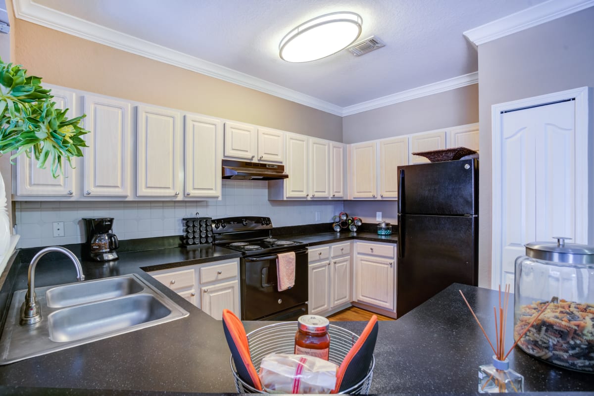 Spacious open kitchen with plenty of counter top space at Amara at MetroWest in Orlando, Florida
