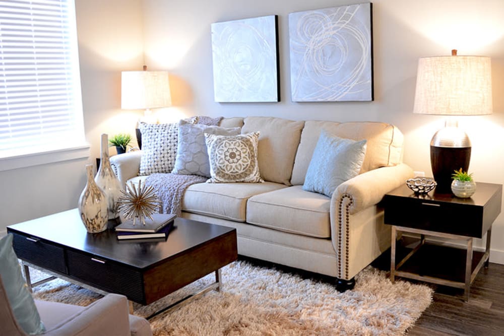 Beautiful living room with lots of natural lighting at Pure St. Peters in Saint Peters, Missouri