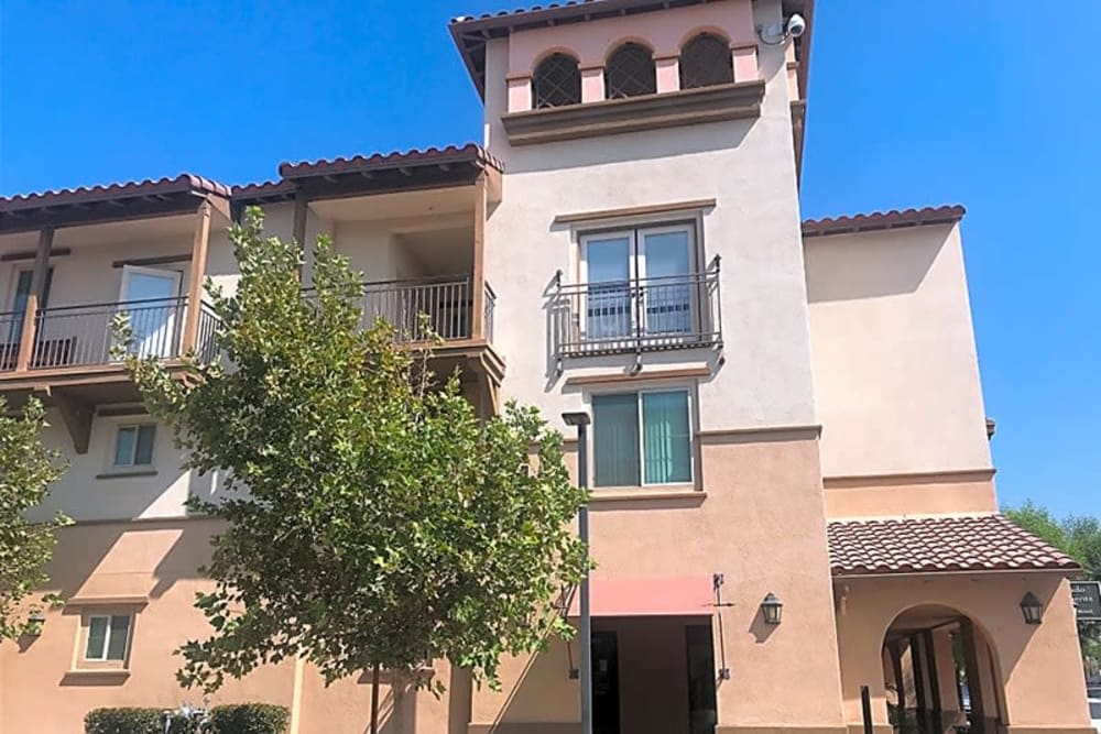 Kitchen with stainless-steel appliances at Mercado Apartments in Perris, California