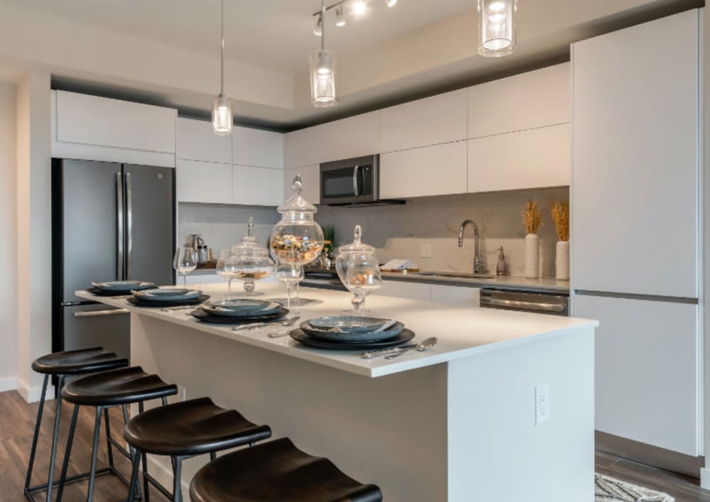 Kitchen with pendant lighting and chef's island at Motif in Fort Lauderdale, Florida