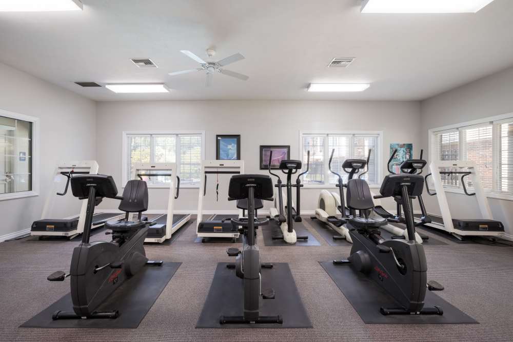 Fitness center with treadmills and windows at Valley View Estates, Council Bluffs, Iowa