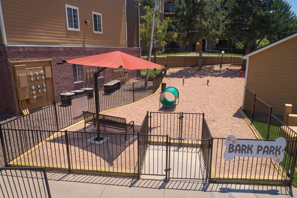 Have fun with your furry friend in the dog park at The Crossings at Bear Creek Apartments in Lakewood, Colorado
