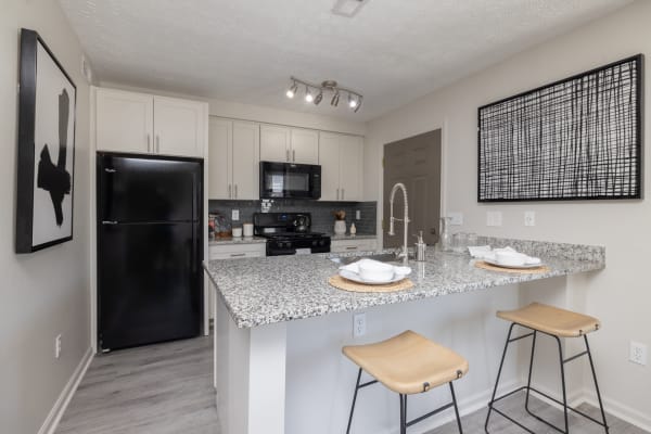 Modern kitchen with countertop seating at The Garratt in Westerville, Ohio