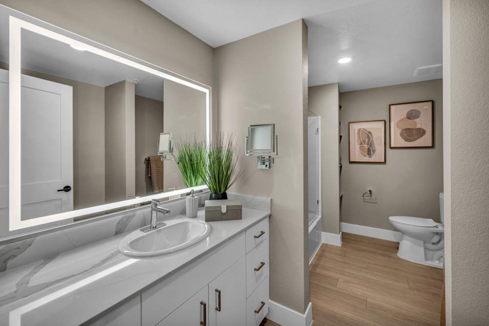 Open living space with kitchen and bar stools at Stone Village Apartments in Reno, Nevada